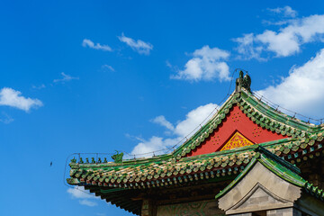 Decoration details of gates and palaces in the Temple of Heaven under blue sky,  a major landmark and travel destination in Beijing, China