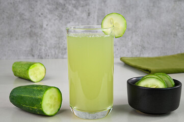 Serving cucumber juice in a glass cup.