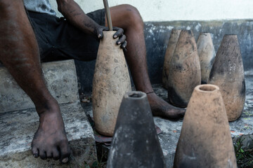 Workers making firecrackers at a workshop 