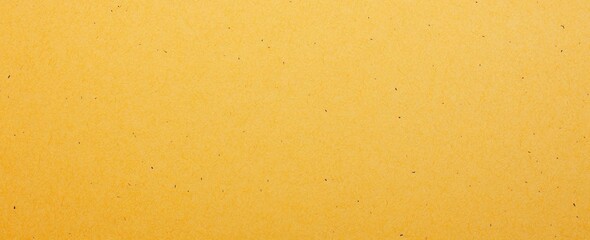 Obraz premium Bright yellow plain paper texture with a smooth finish