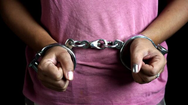 Woman hands in handcuffs