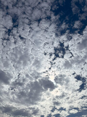 Beautiful sky above clouds with dramatic light. Abstract nature background. Dramatic and moody blue cloudy sky