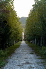 Road At The Entrance Of A School Surrounded By Trees With A Building In The Background In The Lake Area Of Banyoles