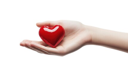 Fototapeta premium Child's hand holding red heart-shaped object symbolizing love and care concept