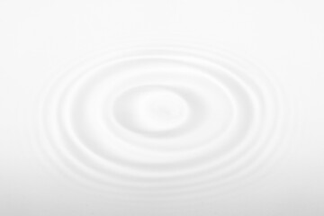 Water with circular ripples. Fluid motion, natural pattern.