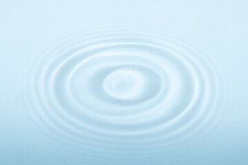 Water with circular ripples. Fluid motion, natural pattern.