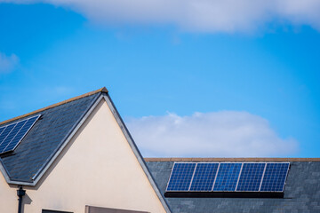 Fototapeta premium Solar energy panel on new built house roof in england uk