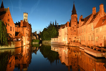Fototapeta premium Old town of Bruges, Belgium. Bruges cityscape with medieval houses and canal at night, Bruges (Brugge), Belgium.