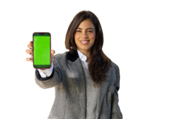 Smiling Latina businesswoman showcasing a green screen smartphone
