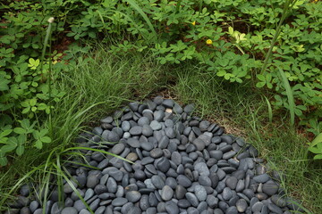 small gray stones and grass for the yard garden decoration
