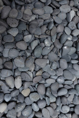 A group of rounded weathered rocks in full frame. Background texture.
BLACK MEXICAN BEACH PEBBLES