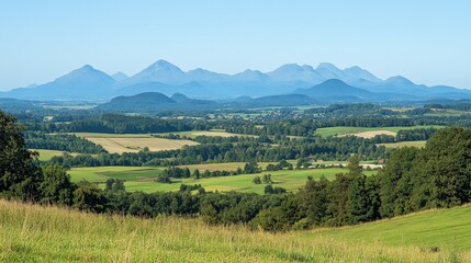 Obraz premium Picturesque Mountain Landscape with Rolling Hills and Meadows