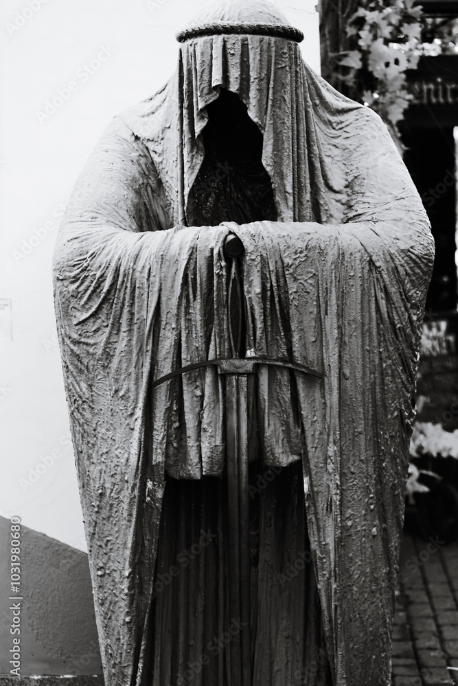 Poster a classic image of an old statue in monochrome.