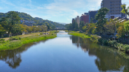 A serene view of the Kuzugawa River in Kanazawa, Ishikawa Prefecture in Japan