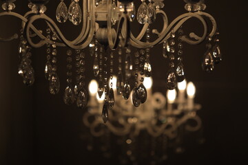 A decorative chandelier with numerous crystal beads hanging from it, suitable for use in interior...