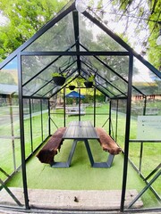 Outdoor gazebo with table in the garden 