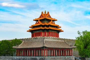 Watch Tower of Forbidden City under blue sky with white cloud at sunset in Beijing, China