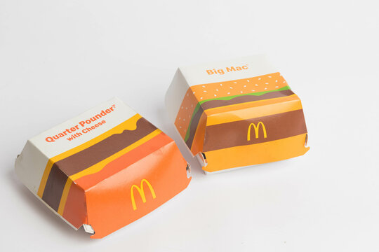 London, United Kingdom, 14th October 2024:- A view of a McDonalds Big Mac and Quarter Pounder with Cheese boxes, against a white background