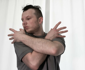 Dance in motion, pose of a man in hip-hop style clothes. Sports dancing guy in training poses....
