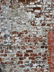 Mur de brique rouge et platre