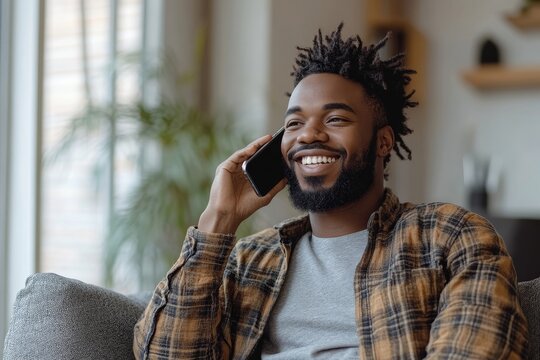 Phone call. Happy afro man talking on mobile phone while sitting on sofa at home, Generative AI