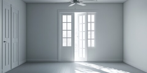 A simple room with a ceiling fan spinning and a window allowing natural light in