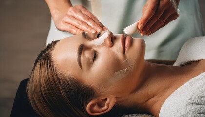 Naklejka premium Woman Enjoying a Facial Treatment 