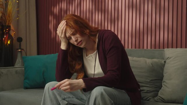 Caucasian sad pregnant woman girl future mother mom at home stressed confused upset check positive result unwanted pregnancy ovulation test anxious desperate female health problem fertility abortion