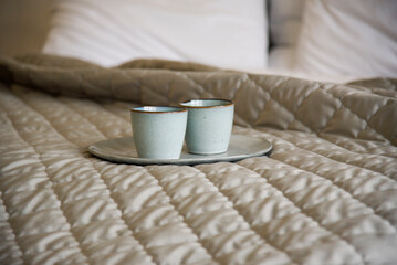 two cups of coffee in bed. Morning time