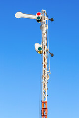 Old railway semaphore against blue sky