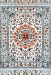 Fototapeta premium Persian Rug with Soft Ivory and Orange Floral Patterns