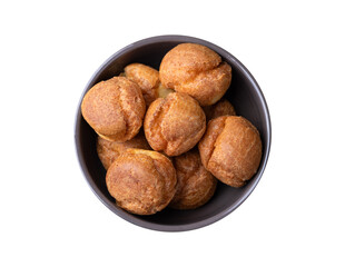 Broa, typical brazilian corn flour bread in a bowl isolated over white background
