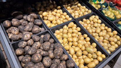 Potato. Shelf with potatoes in supermarket. Fresh organic potatoes for sale.