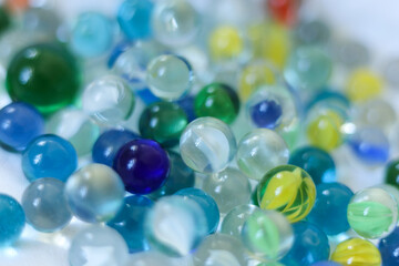 Colorful marbles close-up macro photography. Selective focus.