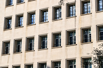 Symmetrical Windows on a Modern Beige Building Facade