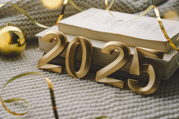 Golden numerals reading 2025 are surrounded by festive decorations, including stars and ornaments,...