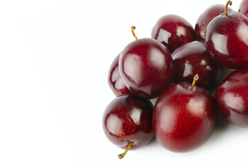Fresh plums isolated on white. Free space for text.
