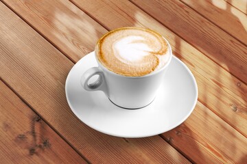 coffee drink with latte art on table in cafe