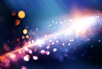 Blurry background with bokeh lights in various colors of pink, orange, blue and white.