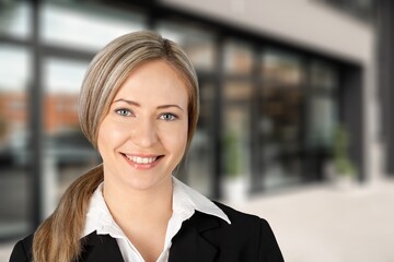 Young smart business woman posing at work