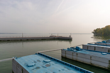 Pontoon bridge with a pier on the lake