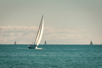 Sailboats in a calm sea.