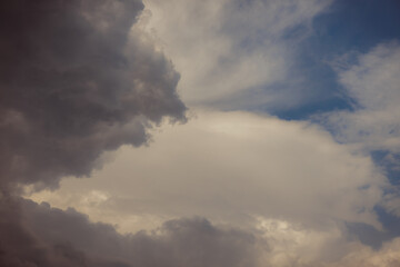 White heap clouds in the blue peaceful sky. The concept of psychological calmness and health. Peace of mind with the forces of nature. Air travel concept.