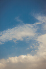 Fototapeta premium White heap clouds in the blue peaceful sky. The concept of psychological calmness and health. Peace of mind with the forces of nature. Air travel concept.