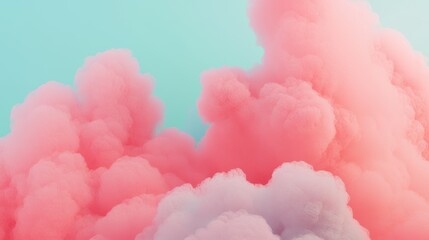 Fototapeta premium A dreamy scene featuring fluffy pink and white clouds against a soft blue background, evoking a sense of calmness and whimsy.