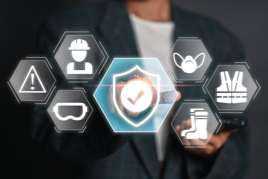 Visual representation of work safety with digital icons of protective gear and safety shield, emphasizing modern workplace security.