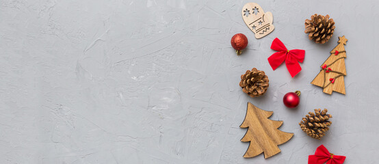 New Year composition. Christmas decor background with pine cones. Top view with copy space