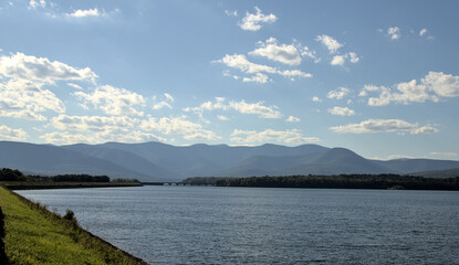 view of the catskills mountains with ashokan reservoir in the foreground on a bright sunny day in the summer (hudson valley catskill hills) scenic travel destination upstate new york lake pond