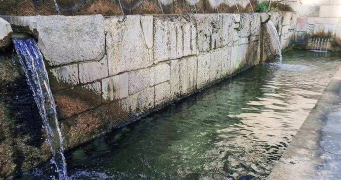 fountain of the 99 Sprouts, detail of Historic fountain with 99 jets distributed among three walls, L'Aquila, Italy