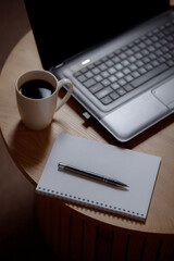 Writer's high: laptop, blank page and aromatic coffee. Coffee creative: ideas on a blank sheet with...